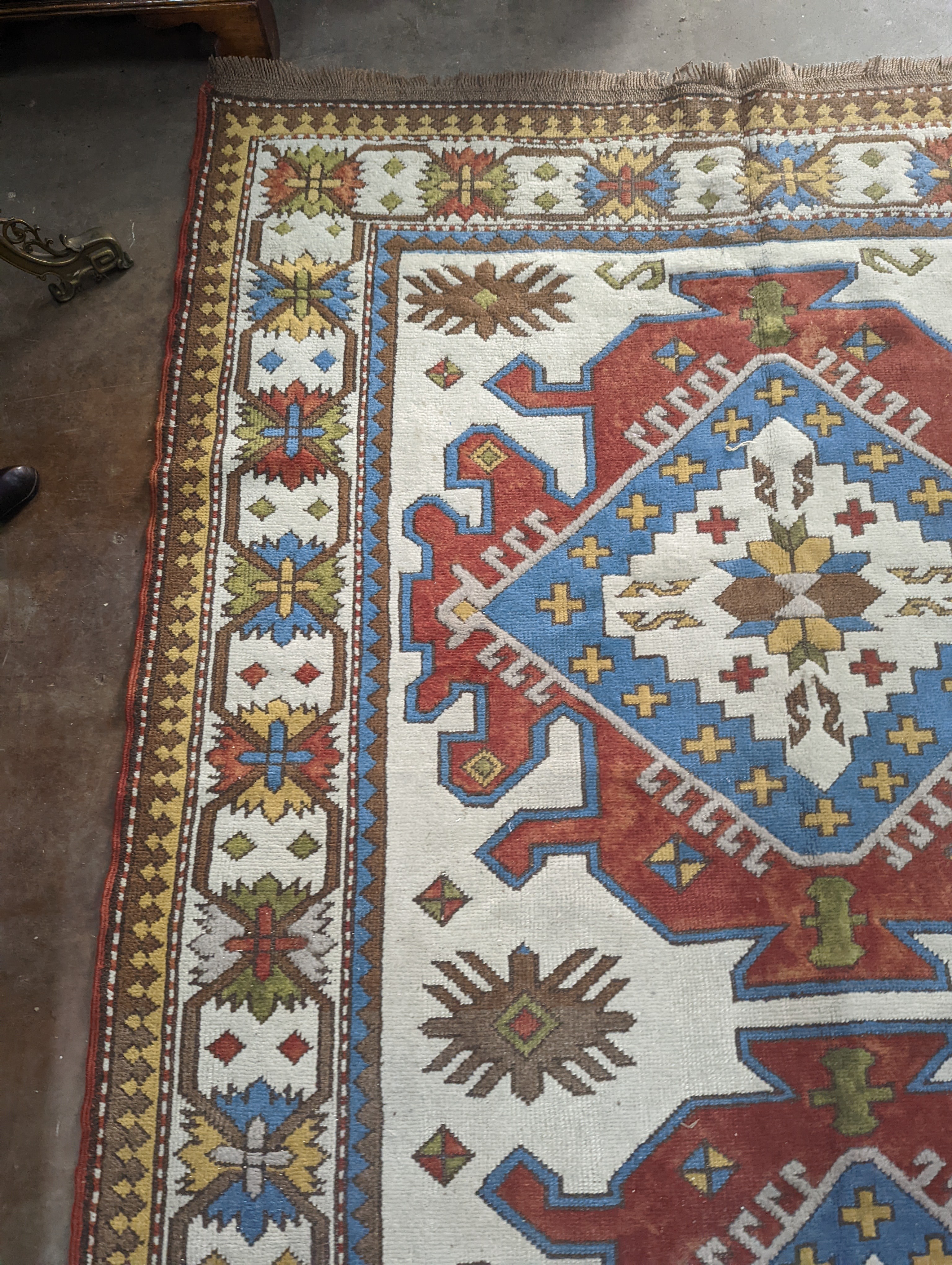 A Caucasian design ivory ground carpet, 270 x 170cm